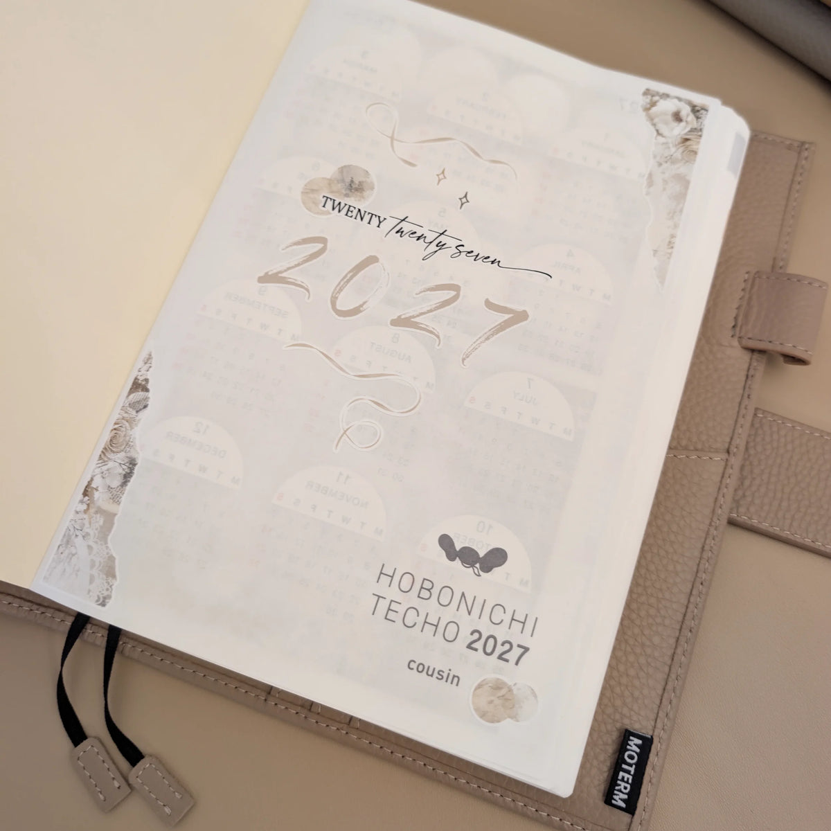 Douce Mémoire 2027 title stickers installed on the opening page of a Hobonichi Cousin