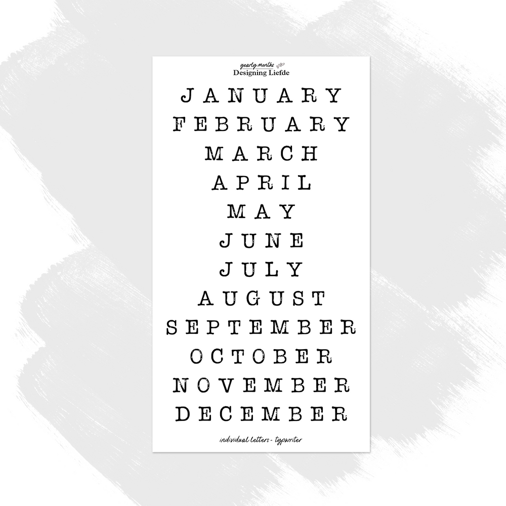 Typewriter Months of the Year Stickers with individually kiss-cut black letters arranged as 12 month names